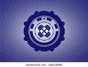 dumbbell icon inside jean background