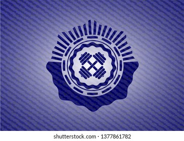 dumbbell icon inside jean background