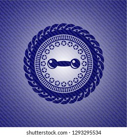 dumbbell icon inside jean or denim emblem or badge background