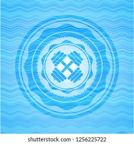 dumbbell icon inside light blue water wave badge.