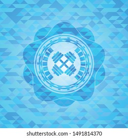 dumbbell icon inside light blue emblem with mosaic background