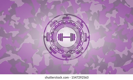 dumbbell icon inside pink and purple camouflaged emblem