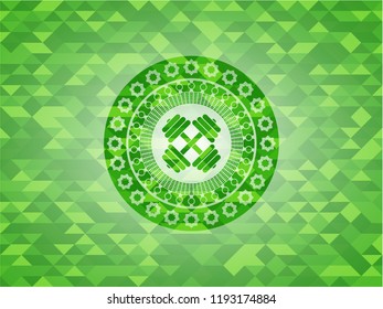 dumbbell icon inside realistic green emblem. Mosaic background