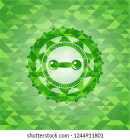 dumbbell icon inside realistic green emblem. Mosaic background