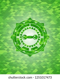 dumbbell icon inside realistic green emblem. Mosaic background