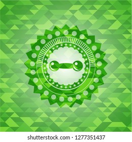 dumbbell icon inside realistic green mosaic emblem