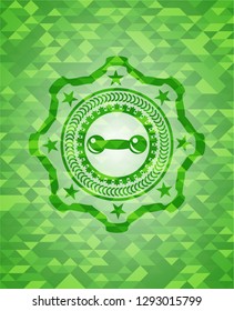 dumbbell icon inside realistic green emblem. Mosaic background