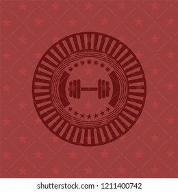 dumbbell icon inside red emblem