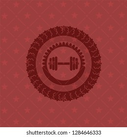 dumbbell icon inside red icon or emblem