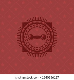 dumbbell icon inside red emblem