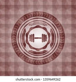dumbbell icon inside red seamless emblem or badge with geometric pattern background.