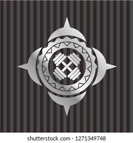 dumbbell icon inside silver badge or emblem