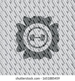 dumbbell icon inside silver color badge or emblem. Scales pattern. Vector Illustration. Detailed.
