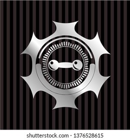 dumbbell icon inside silver emblem or badge