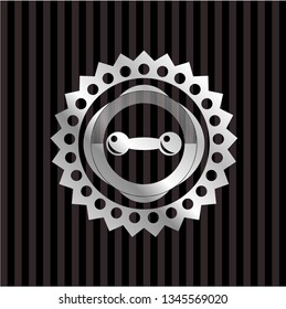 dumbbell icon inside silvery badge
