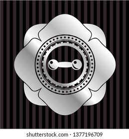 dumbbell icon inside silvery badge