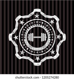 dumbbell icon inside silvery emblem
