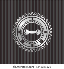 dumbbell icon inside silvery emblem or badge