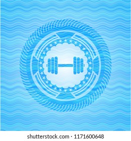 dumbbell icon inside sky blue water style badge.