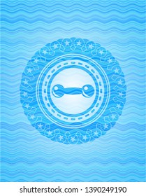 dumbbell icon inside water concept badge.