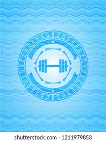 dumbbell icon inside water representation emblem.