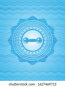dumbbell icon inside water wave concept style badge.