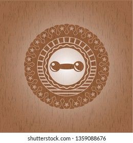 dumbbell icon inside wooden emblem. Retro