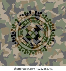 dumbbell icon on camouflaged pattern
