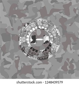 dumbbell icon on grey camo texture
