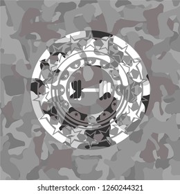 dumbbell icon on grey camo pattern