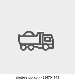 Dump truck icon thin line for web and mobile, modern minimalistic flat design. Vector dark grey icon on light grey background.