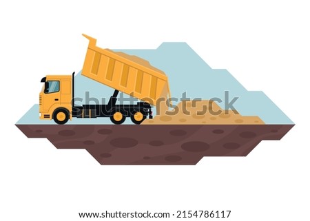 Dump truck unloading waste, heavy machinery used in the construction and mining industry