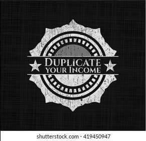 Duplicate your Income written on a blackboard