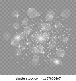 The dust sparks and golden stars shine with special light. Vector sparkles on a transparent background. Christmas light effect. Sparkling magical dust particles.