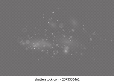 Dust sparks and stars shine with a special light. Christmas light effect. Glittering particles of magic dust.Vector sparkles on a transparent background.