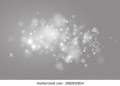 Dust sparks and stars shine with a special light. Christmas light effect. Glittering particles of magic dust.Vector sparkles on a transparent background.