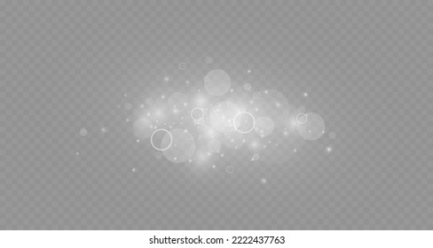 Dust sparks and stars shine with a special light. Christmas light effect. Glittering particles of magic dust.Vector sparkles on a transparent background.