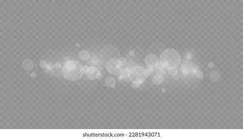 Dust sparks and stars shine with a special light. Christmas light effect. Glittering particles of magic dust.Vector sparkles on a transparent background.