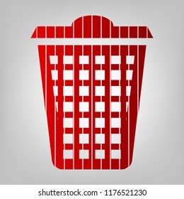 Dustbin icon. Vector. Vertically divided icon with colors from reddish gradient in gray background with light in center.