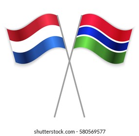 Dutch and Gambian crossed flags. Netherlands combined with Gambia isolated on white. Language learning, international business or travel concept.