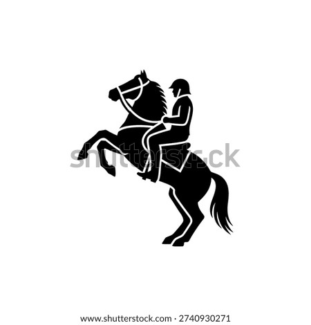 Dynamic black silhouette of a rider on a horse rearing up, showcasing power and equestrian skill.