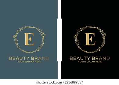 E Beauty vector initial logo, Golden floral letters with flowers leaves and gold splatters isolated on white background. Vector illustration for wedding, greeting cards, invitations template design