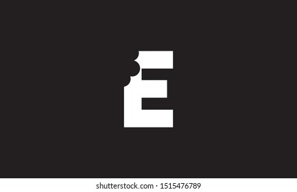 E bite letter logo. Unique attractive creative modern initial E logo with bites shape design