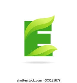 E icon with green leaves. Vector eco design.