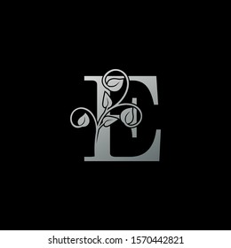 E Letter  logo icon. Monochrome Design concept logo  letter E  with  leaves silver color for initial, fashion, restaurant, cafe, hotel and more brand identity.