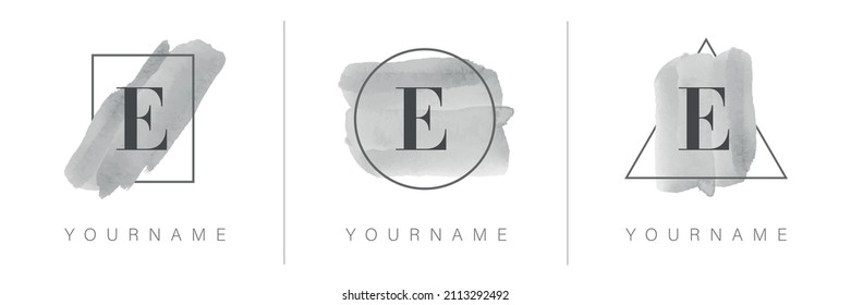 Logotipo de letra E con diseño de rectángulo, círculo y triángulo con trazo de pincel acuarela en tonos grises.