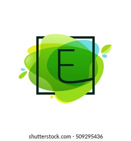 E letter logo in square frame at green watercolor splash background.  Green art. Vector ecology typography for your posters, invitations, cards. 
