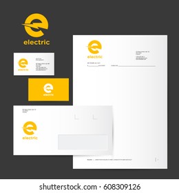 E logo and identity. Electric logo. Yellow logo on business card, letter, envelope.