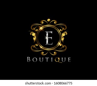 E Luxury Boutique Logo Icon,  E Letter   With Golden Shine On Classy Badge Design.  