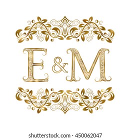 E and M vintage initials logo symbol. The letters are surrounded by ornamental elements. Wedding or business partners monogram in royal style.